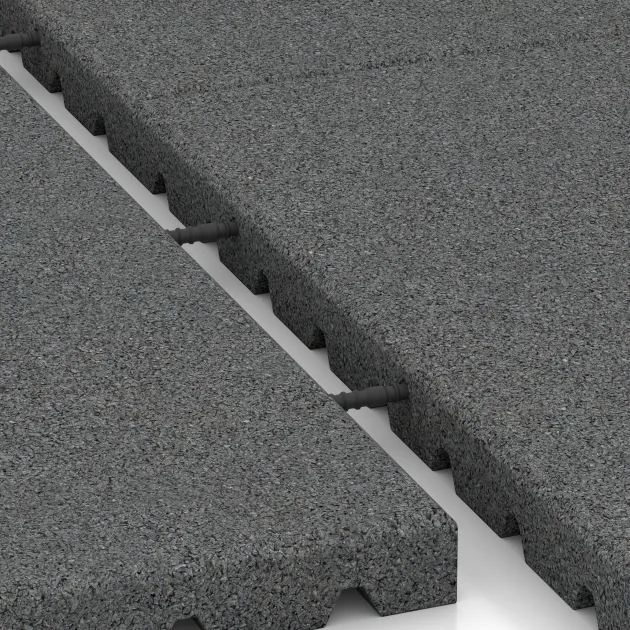 Großaufnahme vom Verbindungssystem von WARCO-Boden 5663 - Płyta gumowa na plac zabaw 4 cm - EN 1177 ≤ 110 cm im Farbdesign Szary łupkowy. Abmessungen 1000 x 1000 x 40 mm.