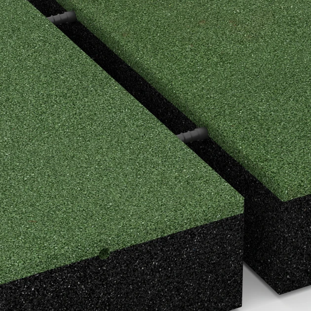 Großaufnahme vom Verbindungssystem von WARCO-Boden 6279 - Płyta amortyzująca – 300 cm im Farbdesign Zielony trawiasty. Abmessungen 50 x 50 x 11 cm.